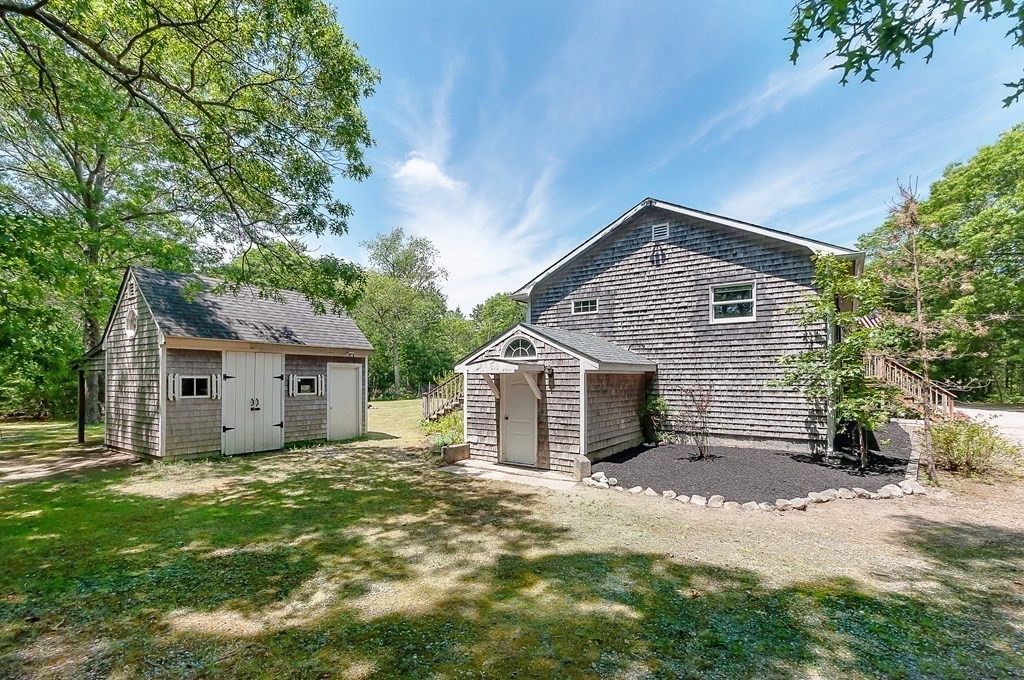 68 Bullock Road Freetown, MA 02717 - Photo 23 of 32 a view of a house with a yard and tree