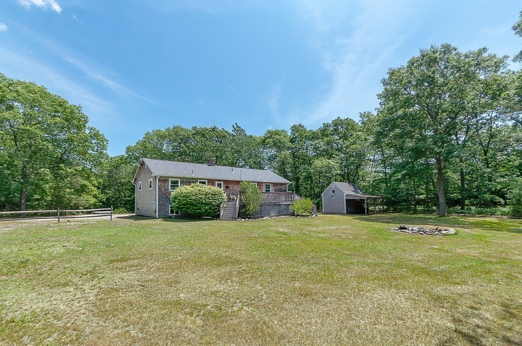 68 Bullock Road Freetown, MA 02717 - Photo 24 of 32 a view of an house with backyard and trees