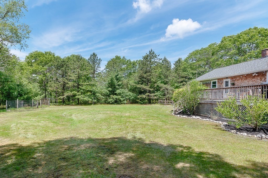 68 Bullock Road Freetown, MA 02717 - Photo 25 of 32 a view of a big yard with a house in the background
