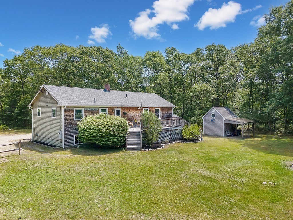 68 Bullock Road Freetown, MA 02717 - Photo 26 of 32 a view of a house with a yard and large trees
