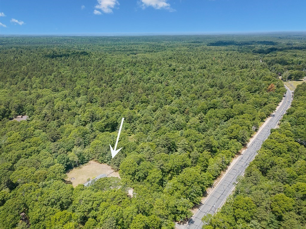68 Bullock Road Freetown, MA 02717 - Photo 5 of 32 a view of a city with lush green forest