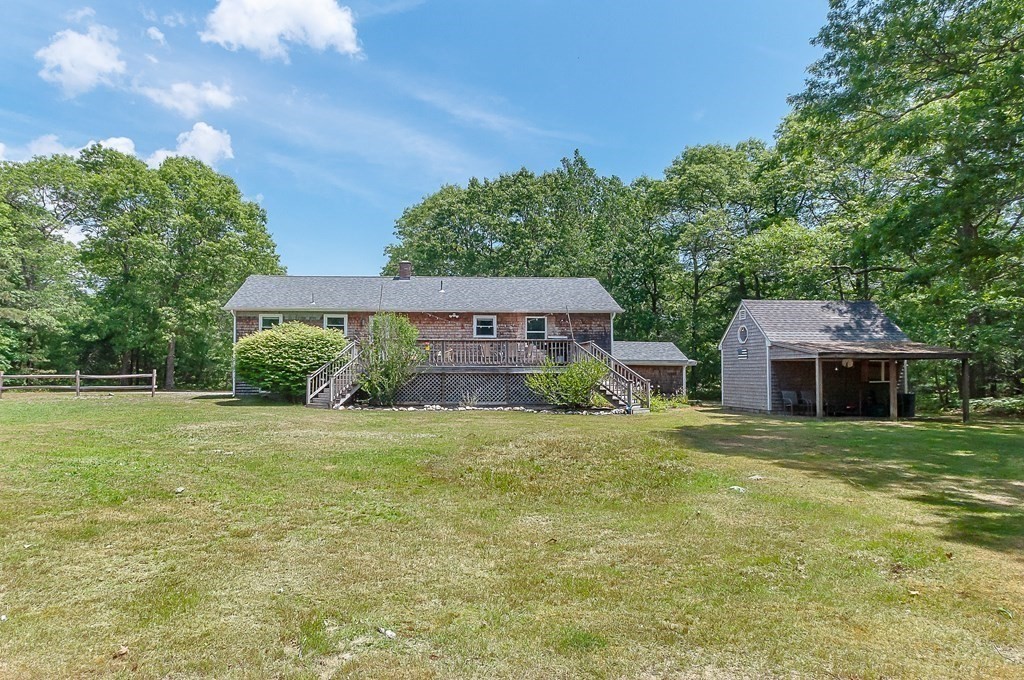 68 Bullock Road Freetown, MA 02717 - Photo 7 of 32 a front view of a house with a garden