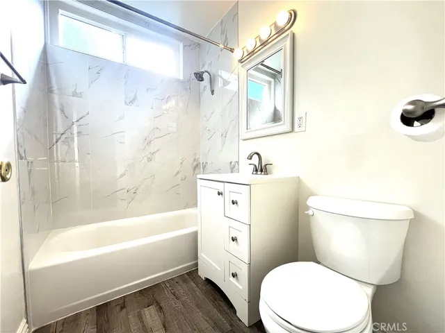 a bathroom with a toilet sink and bathtub