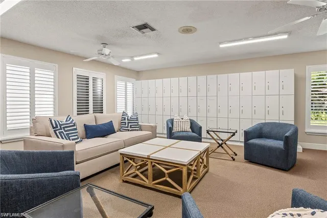 a room with pool table and windows