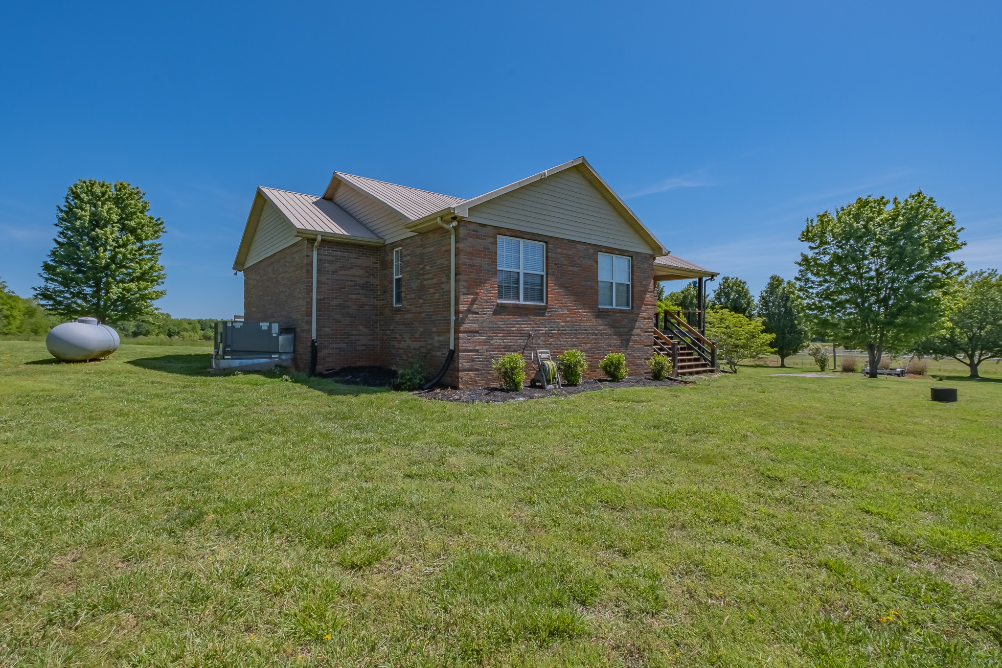 901 Spur Road Decherd, TN 37324 - Photo 3 of 59 a front view of a house with garden