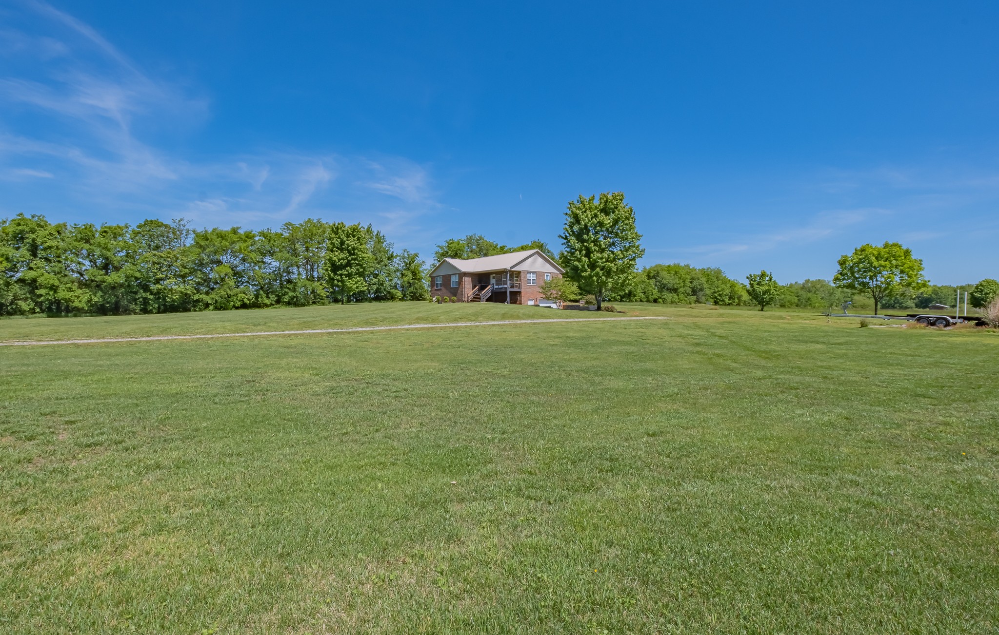 901 Spur Road Decherd, TN 37324 - Photo 45 of 59 a view of a field with an trees in the background