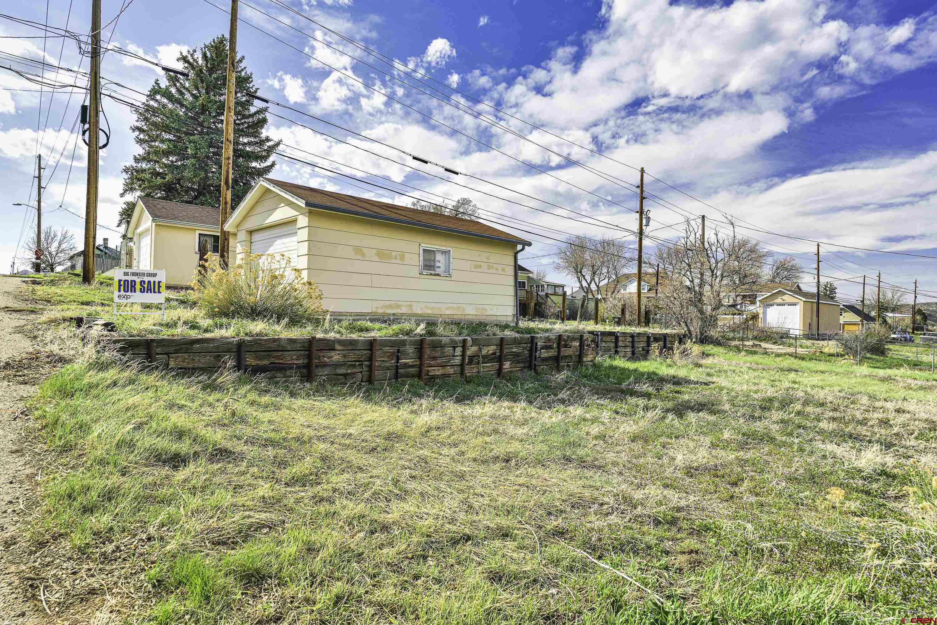 a backyard of a house with lots of green space