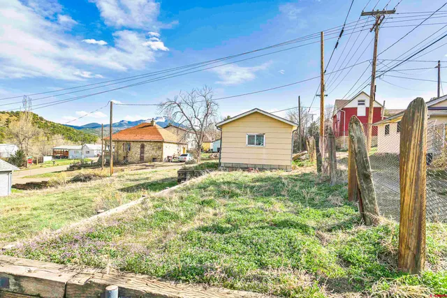 a house view with a backyard space