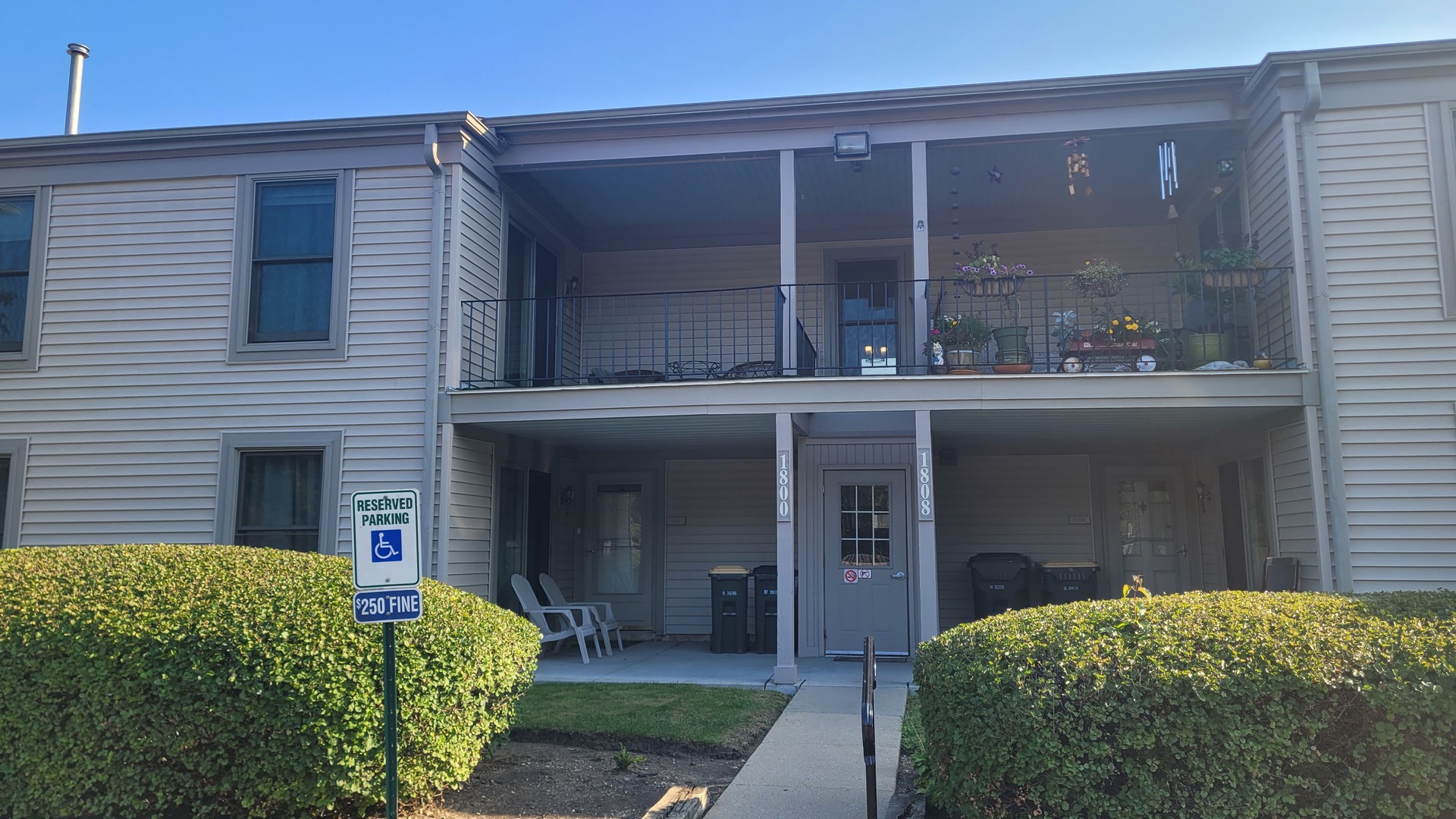 a view of a house with a window and balcony