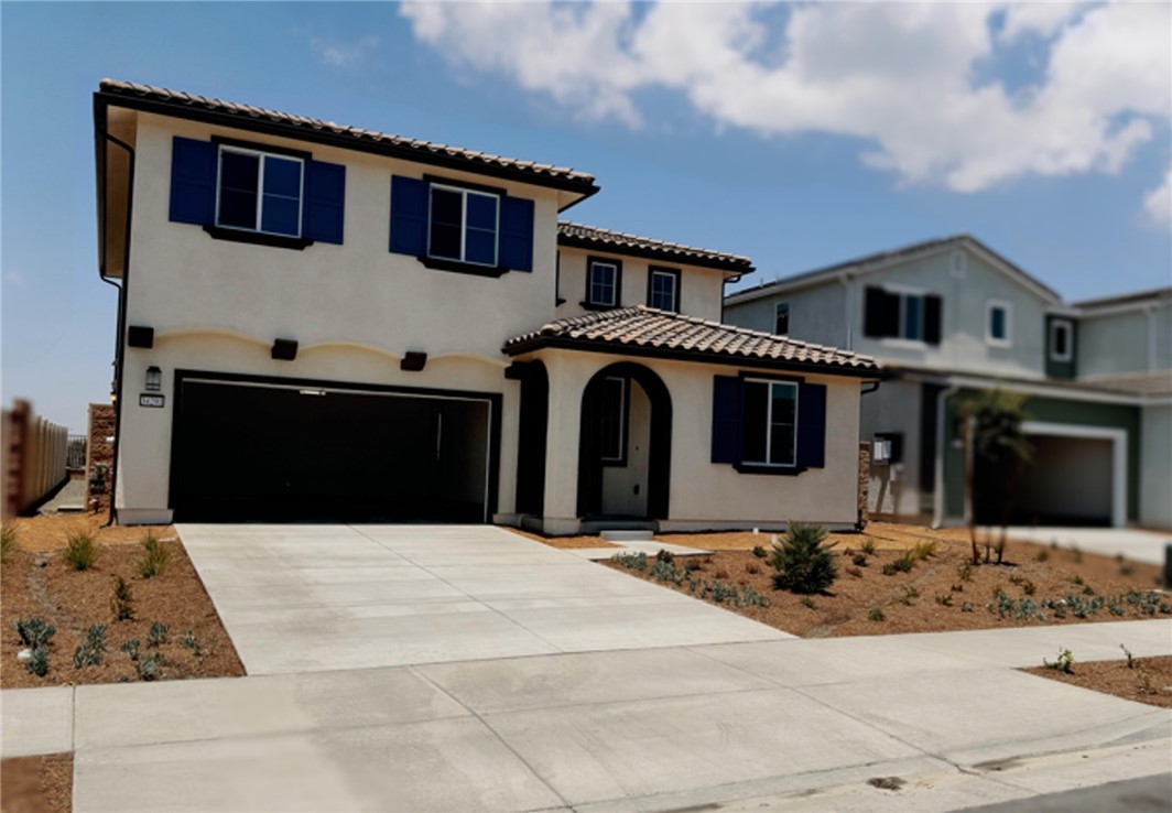 34291 Cyan Cove Winchester, CA 92596 - Photo 1 of 9 a front view of a house with a yard