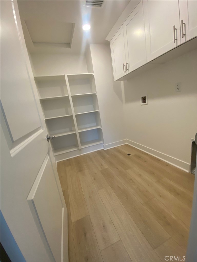 34291 Cyan Cove Winchester, CA 92596 - Photo 5 of 9 a view of an empty room with empty racks