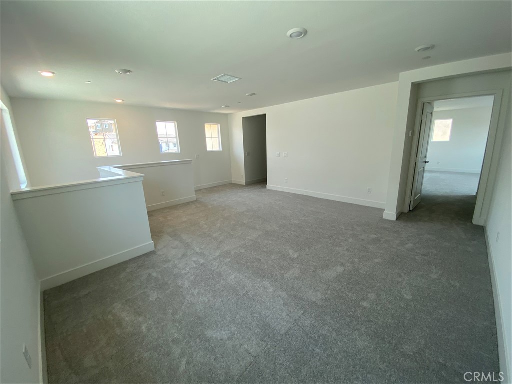 34291 Cyan Cove Winchester, CA 92596 - Photo 7 of 9 a view of empty room with windows