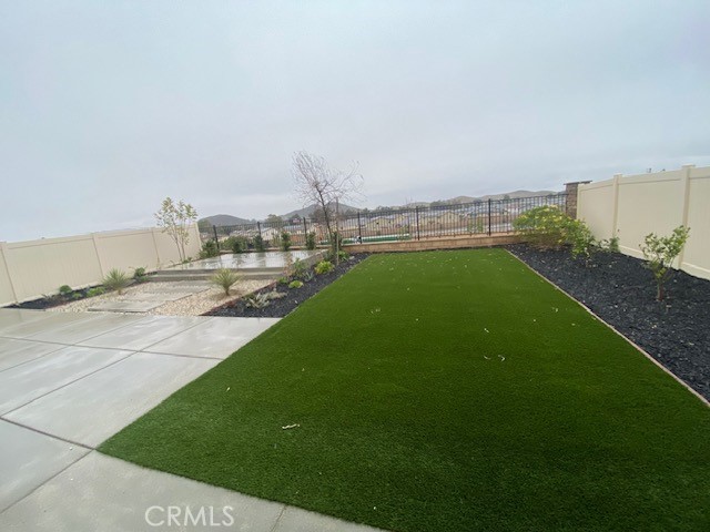 34291 Cyan Cove Winchester, CA 92596 - Photo 9 of 9 a view of a terrace with a garden