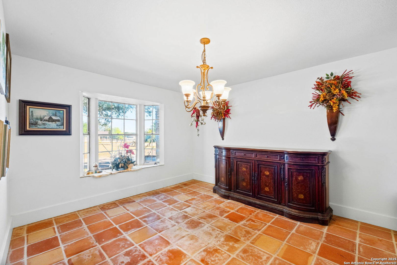 24 Pfeiffer Road Boerne, TX 78006 - Photo 7 of 22 a living room with stainless steel appliances granite countertop furniture a chandelier and a window