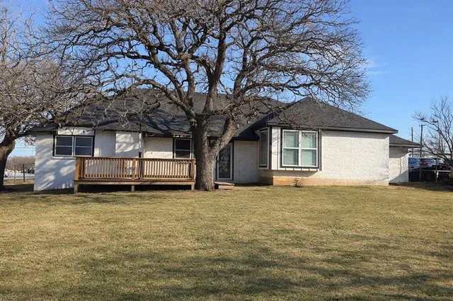 a house with trees in front of it
