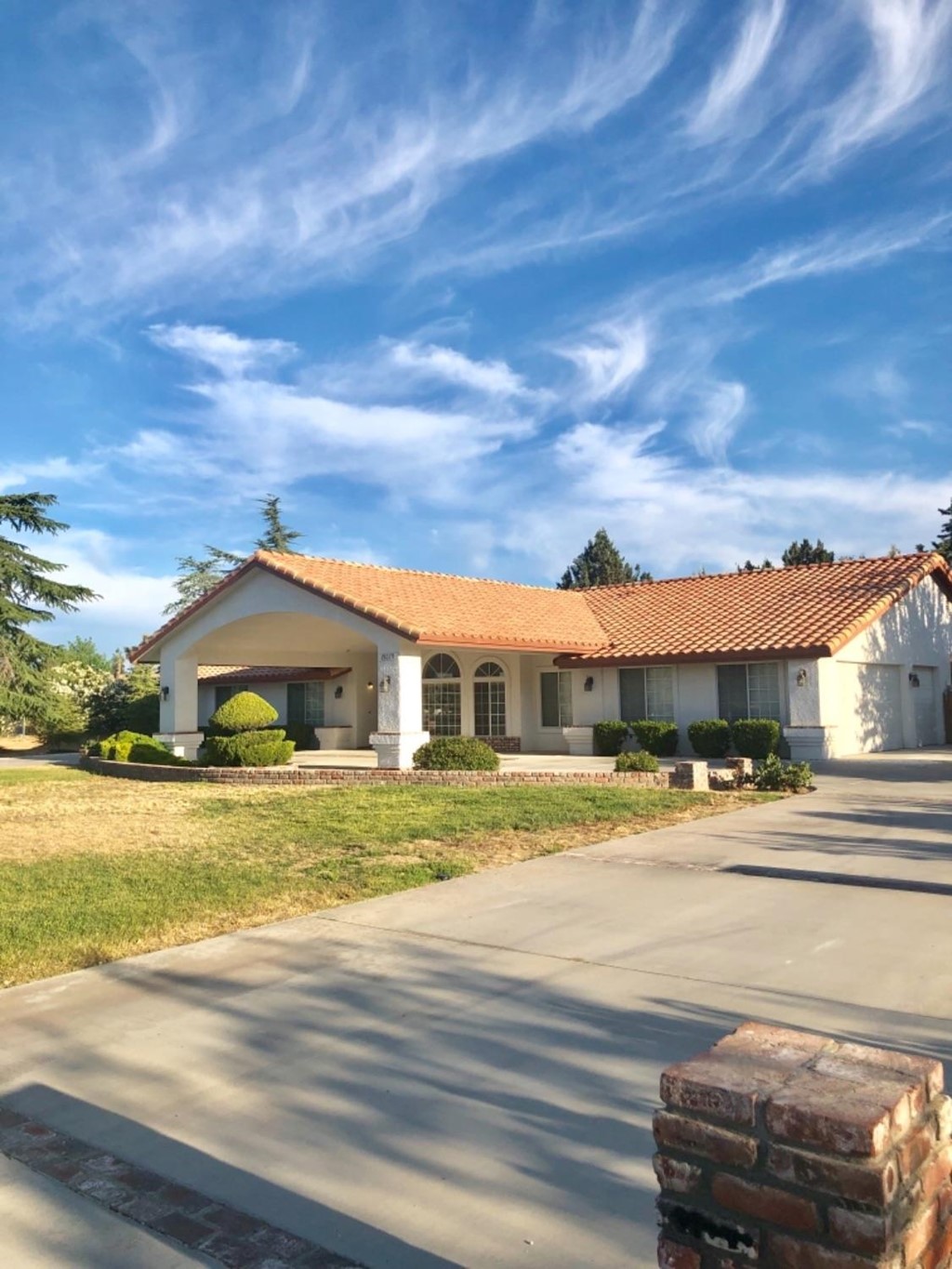19079 Mendota Road Apple Valley, CA 92307 - Photo 1 of 1 a front view of a house with a yard
