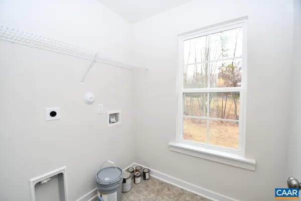 a bathroom with a window a toilet and a window