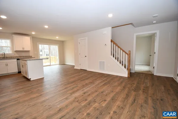 a view of a kitchen with a sink and a window