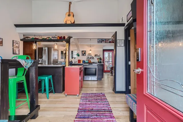 a lobby with furniture and a potted plant