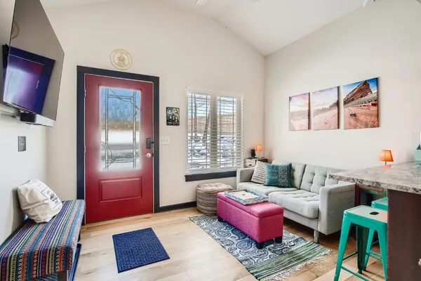 a living room with furniture and a flat screen tv