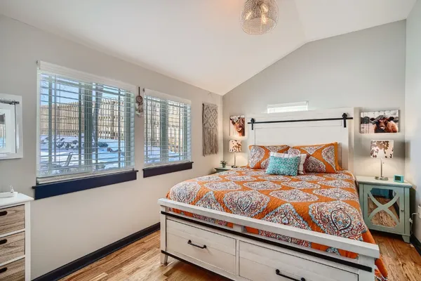 a bedroom with a bed and window