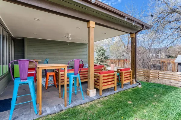 a view of a patio with chairs and table in the patio