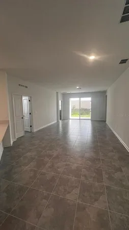 a view of an empty room and window
