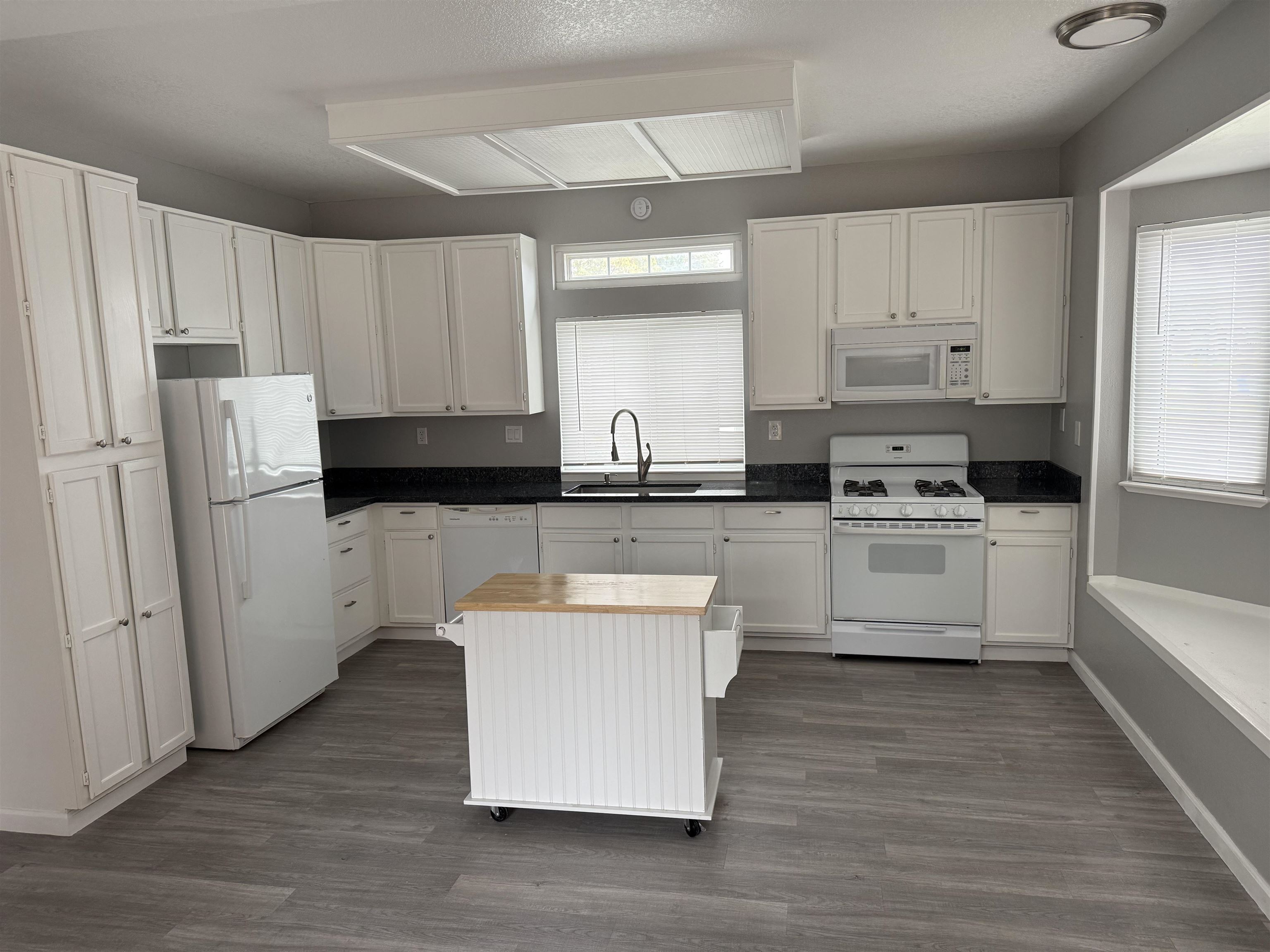 380 West Ruby Street Oakley, CA 94561 - Photo 5 of 18 a kitchen with white cabinets and white appliances