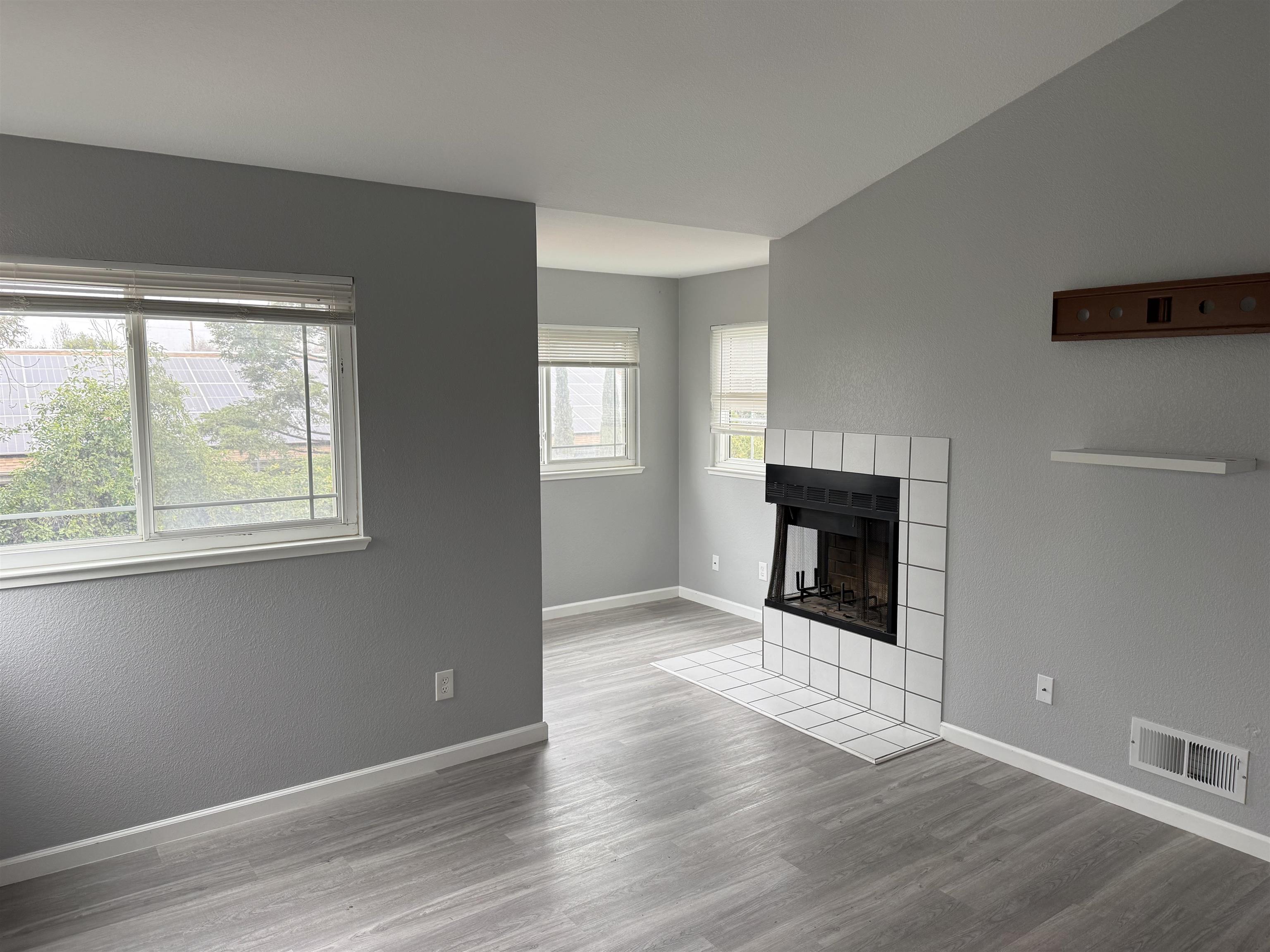 380 West Ruby Street Oakley, CA 94561 - Photo 10 of 18 a view of an empty room with wooden floor and a window