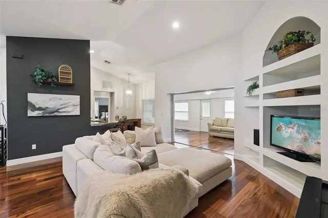a kitchen with stainless steel appliances a sink stove and cabinets