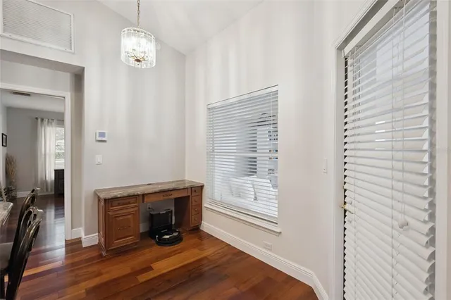 a kitchen with granite countertop a sink and cabinets