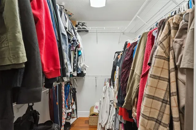 a view of a livingroom with a hardwood floor and a ceiling fan