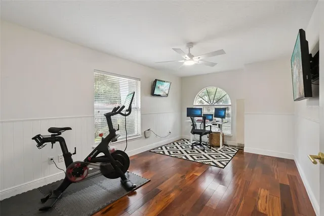 an aerial view of a house with a garden and a yard