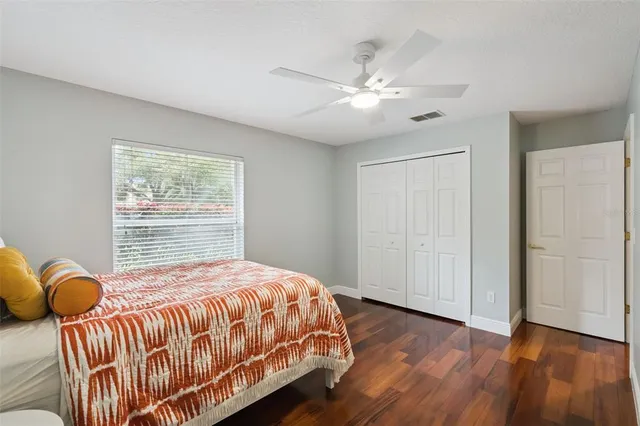 an aerial view of a residential houses with outdoor space and ocean view