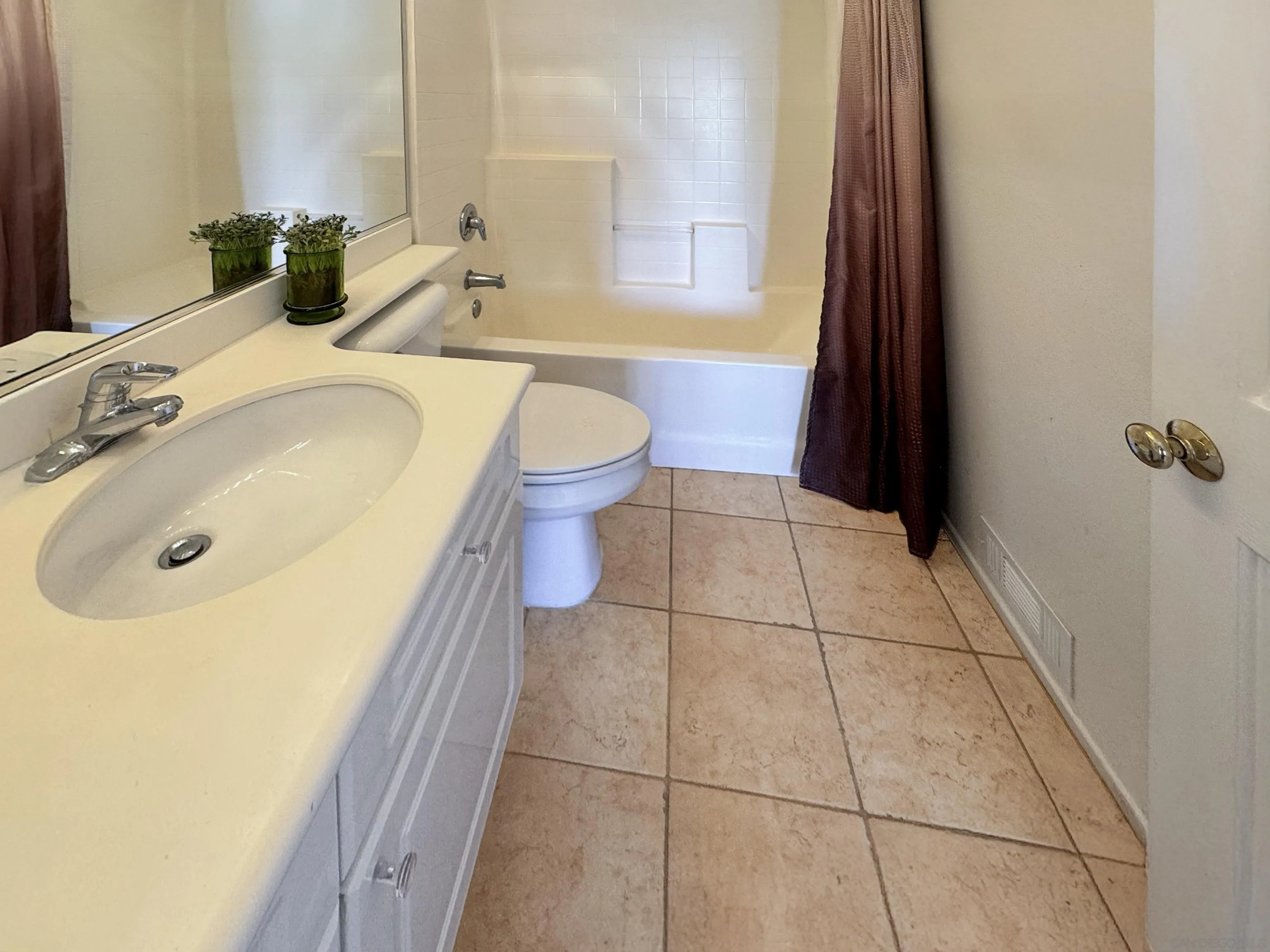 12654 Carmel Country Road, Unit 91 San Diego, CA 92130 - Photo 16 of 22 a bathroom with a sink and a mirror