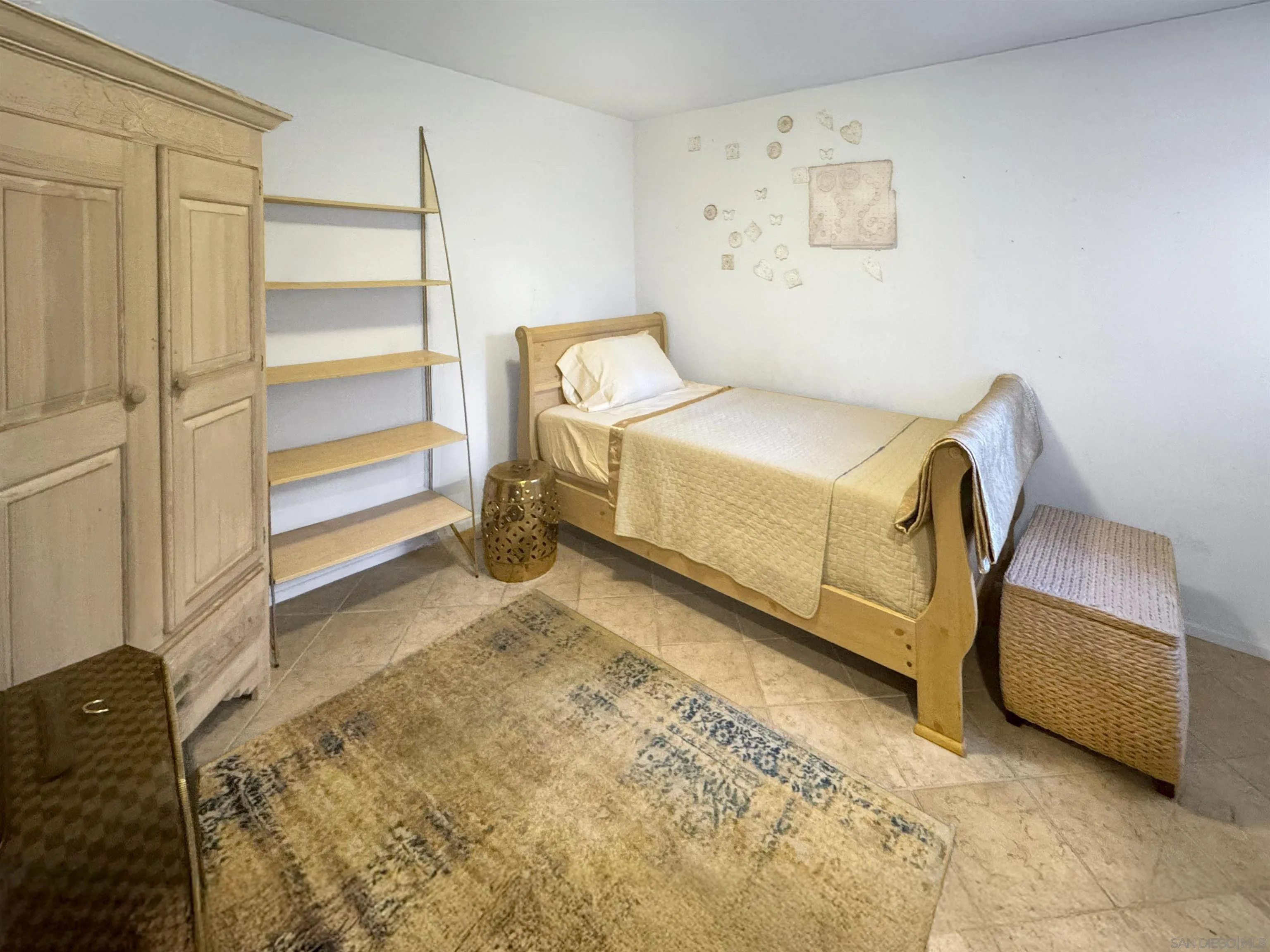 12654 Carmel Country Road, Unit 91 San Diego, CA 92130 - Photo 17 of 22 a bedroom with a bed and a cabinets