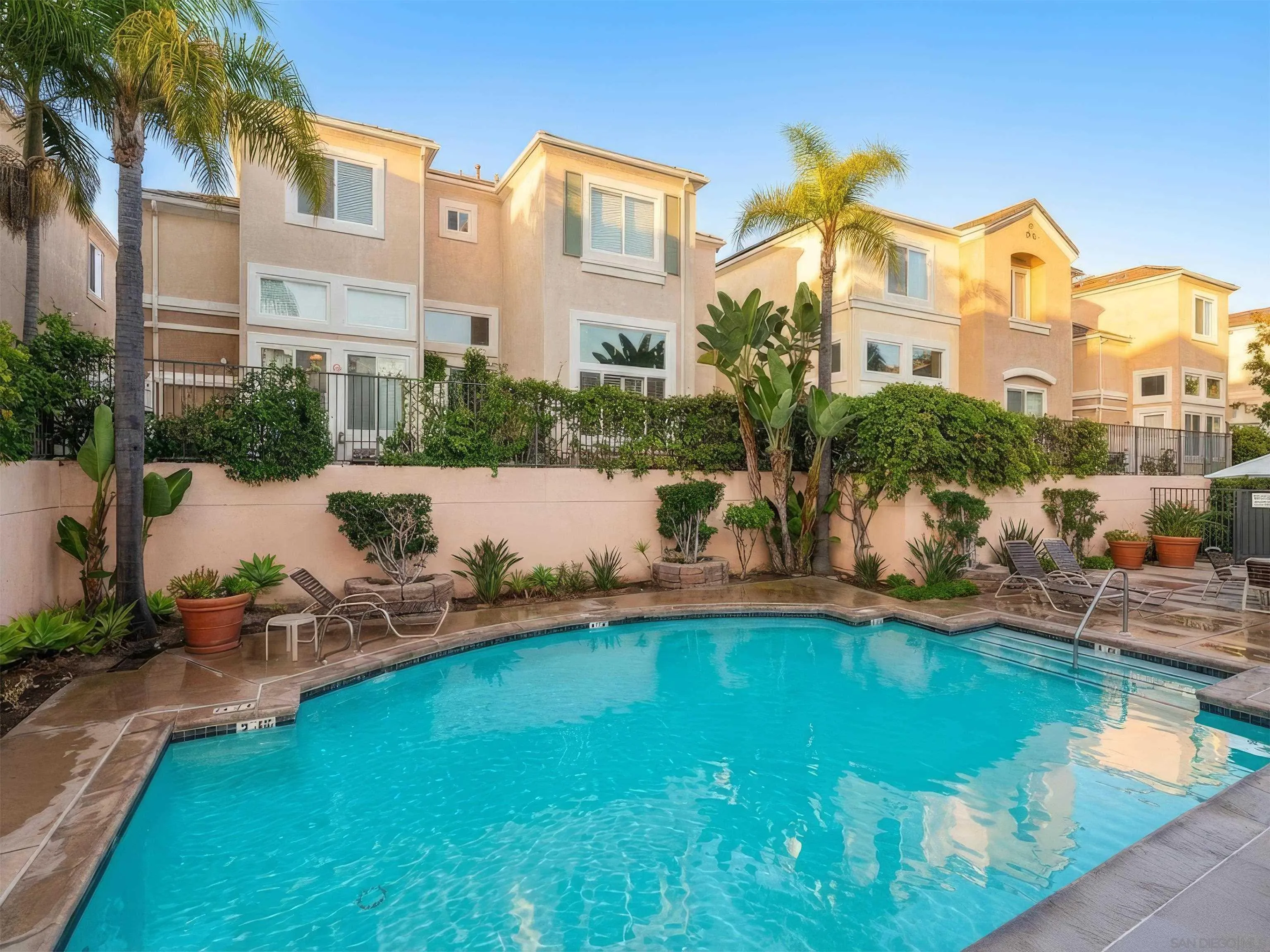 12654 Carmel Country Road, Unit 91 San Diego, CA 92130 - Photo 21 of 22 a front view of a house with swimming pool garden and patio
