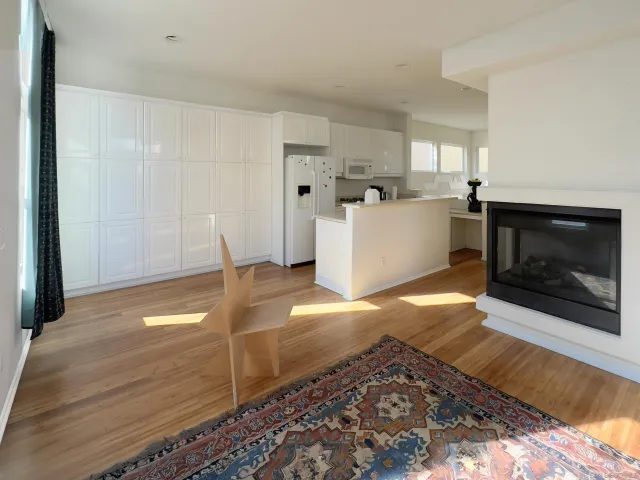 a view of a livingroom with furniture and a fireplace
