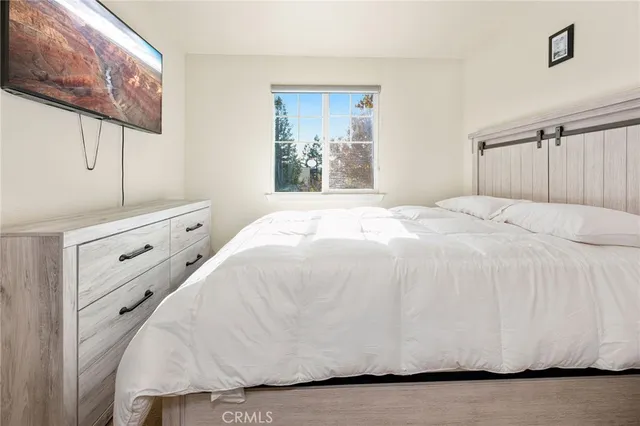 a large white bed in a white room