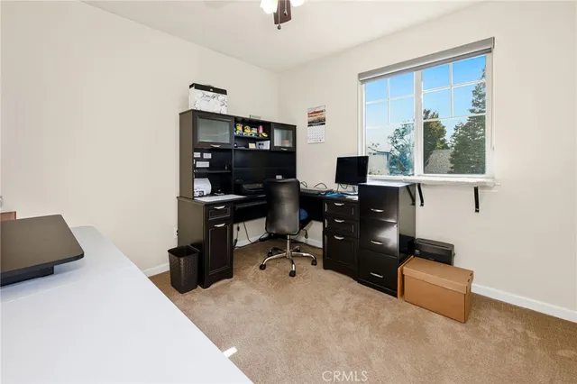 a bedroom with a workspace