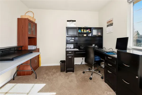 a view of a workspace with furniture