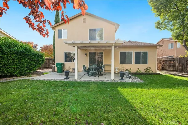 a view of a house with a backyard