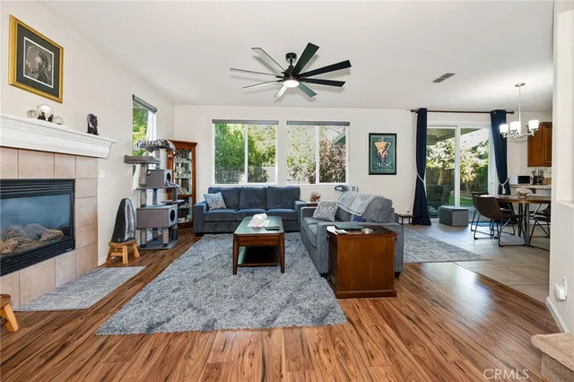 a living room with furniture a fireplace and a table