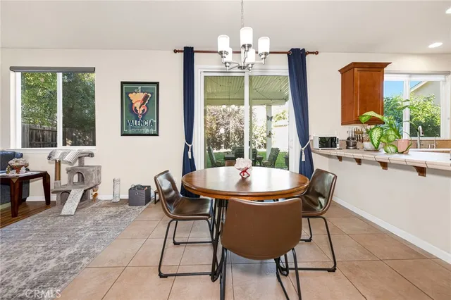 a view of a dining room with furniture window and outside view
