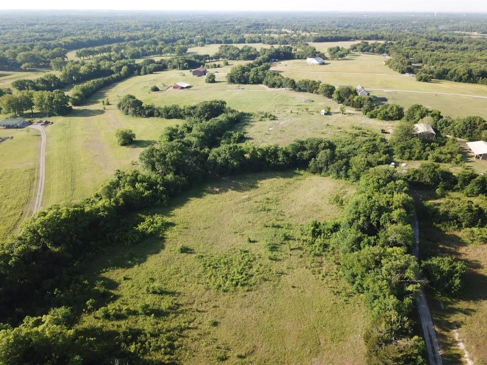 Tbd Ball Road Whitewright, TX 75491 - Photo 10 of 18 Expansive rural landscape featuring lush green fields and dense tree lines