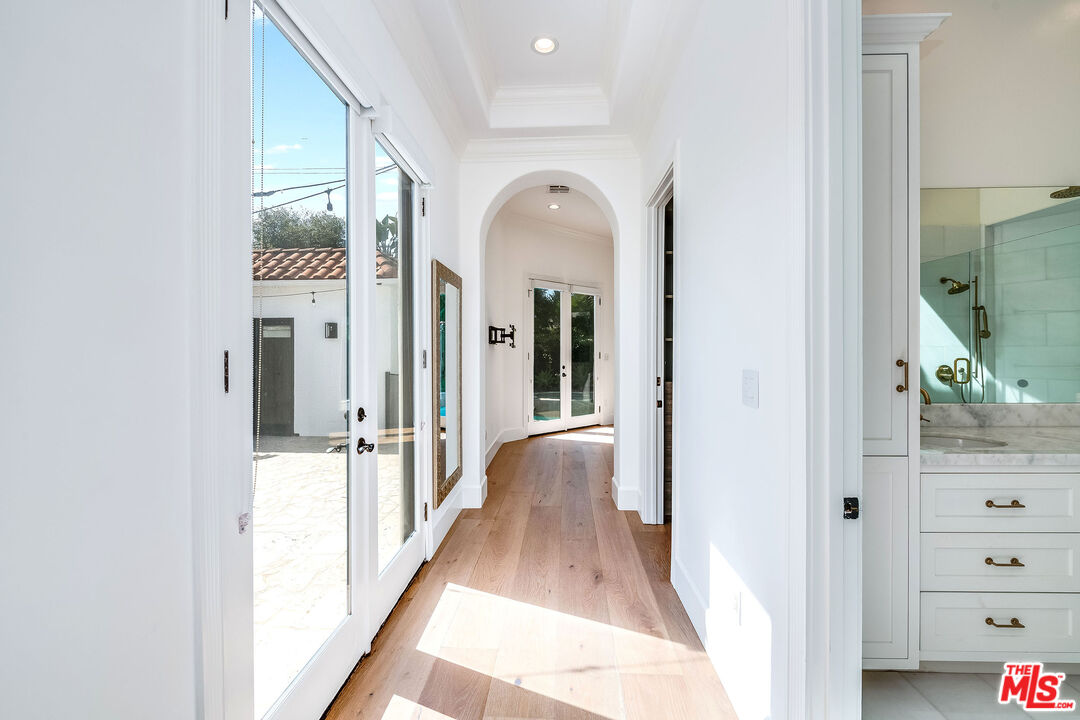 607 North La Jolla Avenue Los Angeles, CA 90048 - Photo 12 of 21 a view of a hallway with wooden floor and closet