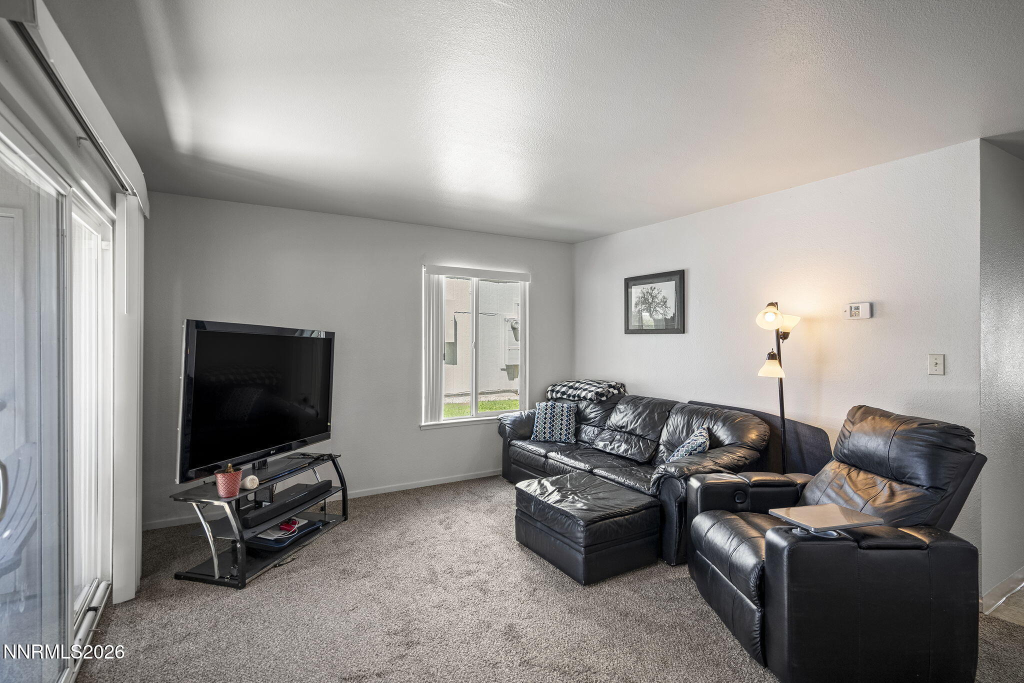 400 South Saliman Road, Unit 129 Carson City, NV 89701 - Photo 6 of 15 a living room with furniture and a flat screen tv