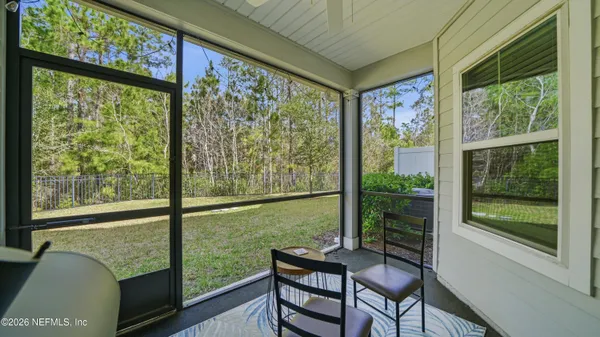a view of a room with furniture and a window