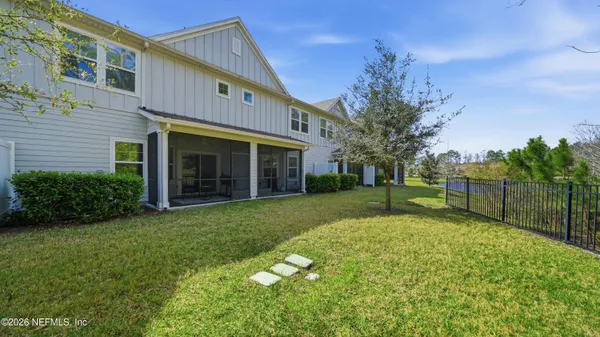 a view of a house with backyard and garden