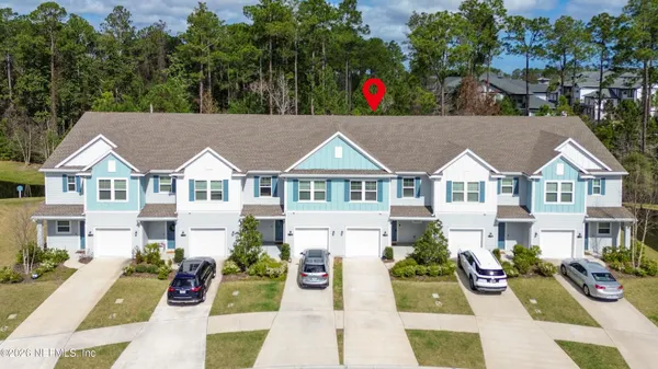 a view of swimming pool with outdoor seating and city view